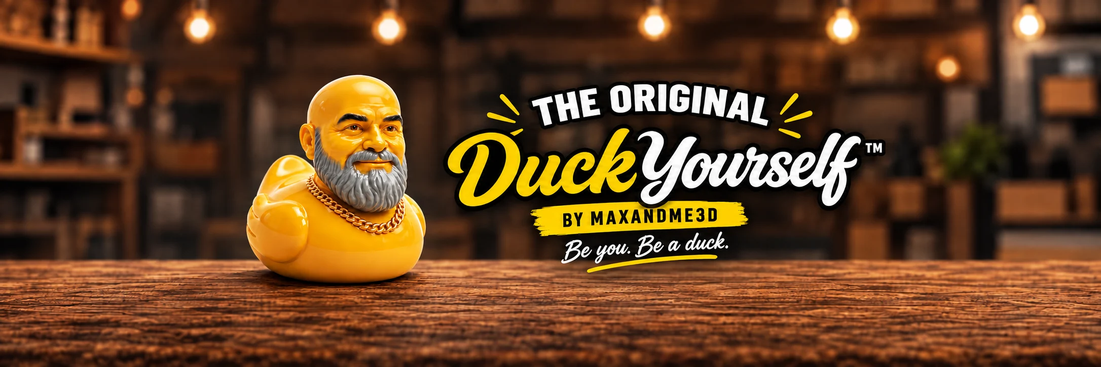 A personalized yellow duck in the Max+Me3D workshop beside the Duck Yourself™ logo